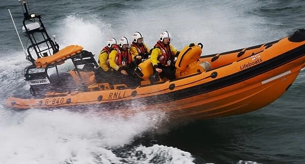 Atlantic 85 inshore lifeboat Harold Baines B-840 during a training exercise in Poole bay. Crew wearing new lifejackets