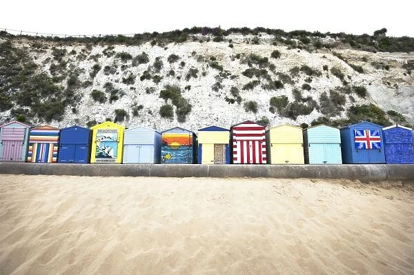 Landscape shot of the colourful beach huts at Broadstairs