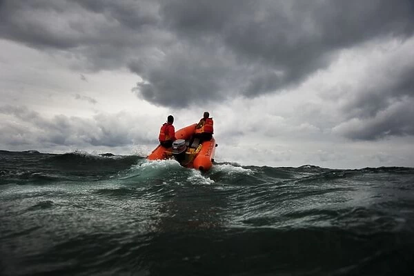 Two lifeguards on an arancia inshore rescue boat at Watergate Bay