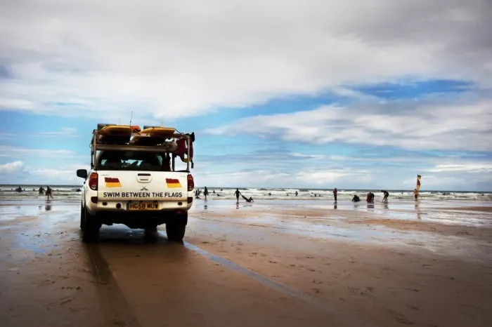 Framed Print : Lifeguards monitoring the beach from a patrol vehicle Framed Print : Lifeguards monitoring the beach from a patrol vehicle