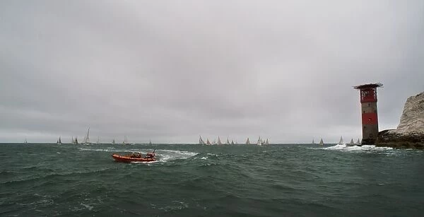 Lymington Atlantic 75 inshore lifeboat Victor Danny Lovelock B-784 during the Round the Island Race 2011.Racing yachts and the Needles lighthouse in the distance