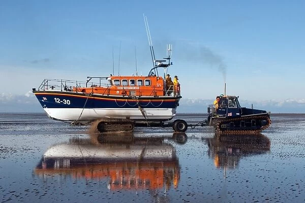 Lytham St Annes Mersey class lifeboat Her Majesty the Queen 12-30 being recovered by tractor on the beach after an exercise