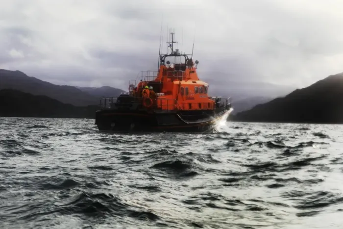 Framed Print : Mallaig severn class lifeboat Henry Alston Hewat 17-26. Lifeboat in the distance moving from left to right, hills and cliffs behind Framed Print : Mallaig severn class lifeboat Henry Alston Hewat 17-26. Lifeboat in the distance moving from left to right, hills and cliffs behind
