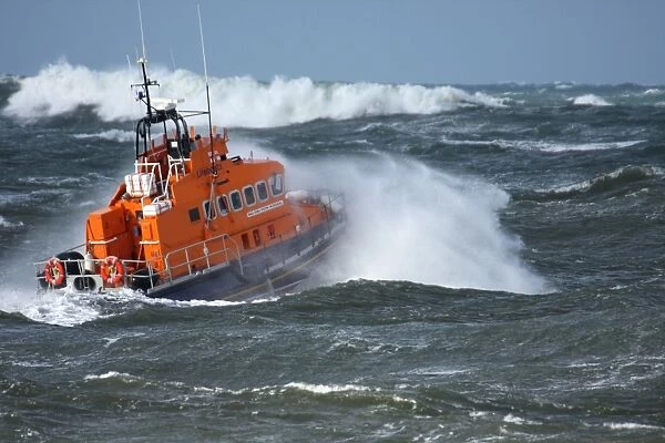 Portrush trent class lifeboat Dora Foster Mcdougall 14-24 moving from left to right in heavy seas, lots of white water