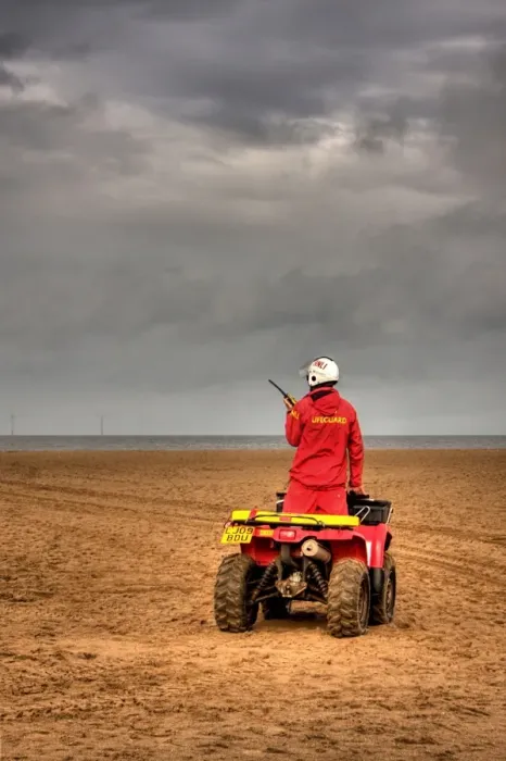 Framed Print : RNLI lifeguard on a quad bike patrol vehicle at Skegness beach Framed Print : RNLI lifeguard on a quad bike patrol vehicle at Skegness beach