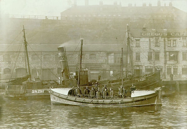 Tynemouth. Self righting motor boat. ON613. Henry Vernon. Ten crew on board. Quay in background