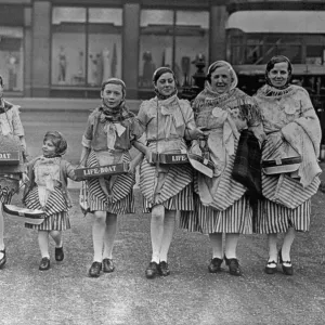 3 ladies and 5 children all with RNLI collection boxes possibly