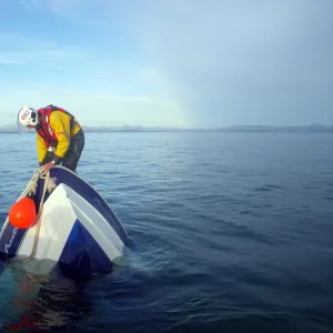 Abersoch crew member on board a sinking vessel. The crew member is attaching a buoy to alert shipping in the area. Second place in the Photographer of the Year 2012