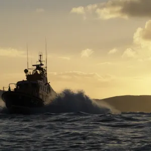 Achill Island trent class lifeboat Sam and Ada Moody 14-28. Lifeboat is heading towards the camera, silhouetted against a dramatic sky