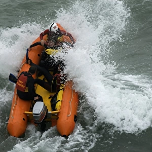 An arancia inshore rescue boat in heavy surf at Perranporth