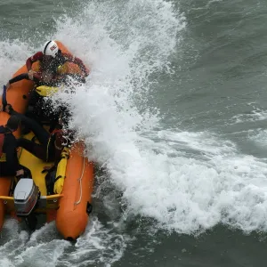 An arancia inshore rescue boat in heavy surf at Perranporth