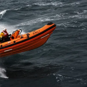 Atlantic 75 inshore lifeboat Dorothy Mary B-728. Lifeboat moving from left to right at speed, lots of white spray