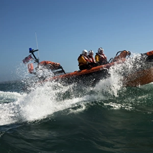 Baltimore Atlantic 75 inshore lifeboat Bessie B-708 moving from left to right, bow high out of the water, lots of white spray