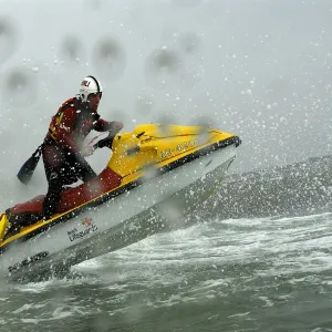 Two beach lifeguards on a rescue water craft