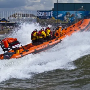 Blackpool Atlantic 75 inshore lifeboat Bickerstaffe heading through a breaking wave. Taken from Fleetwood lifeboat. Shortlisted finallist for Photographer of the Year 2012