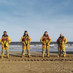 Bridlington ALB crew lined up on the beach in full kit