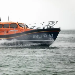 Clifden Shannon class lifeboat St Christopher 13-43 at sea during trials in Poole Bay. Shot from Shell Bay beach, Studland