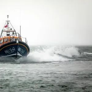 Clifden Shannon class lifeboat St Christopher 13-43 at sea during trials in Poole Bay. Shot from Shell Bay beach, Studland