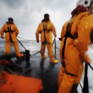 Crew members stood on the fore deck of the Hoylake lifeboat Lady of Hilbre