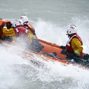 Eastbourne D-class inshore lifeboat Joan and Ted Wiseman 50 D-605. Close up shot, lifeboat moving from right to left, lots of white spray