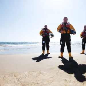 Group shot of Exmouth crew Mark Chamption (left), helmsman Roger Jackson (centre) and Andrew Williams (right). Roger was awarded the bronze medal for gallantry for his part in the rescue of four men from a capsized rib in extremely severe weather