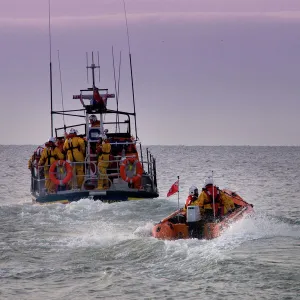 Hastings all weather and inshore lifeboats at sea