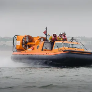 Hunstanton hovercraft The Hunstanton Flyer H-003 heading from left to right at speed, four crew on board