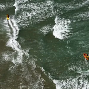 Lifeguards on a rescue watercraft (RWC) and arancia inshore rescue boat shot from Culdrose helicopter in St Ives