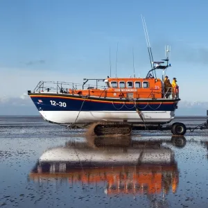 Lytham St Annes Mersey class lifeboat Her Majesty the Queen 12-30 being recovered by tractor on the beach after an exercise