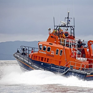 Mallaig severn class lifeboat Henry Alston Hewat 17-26. Lifeboat is moving from right to left, crew at the upper steering position