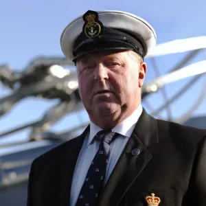 Memorial ceremony of dedication in Poole. St Ives coxswain Tommy Cocking stood in front of the memorial sculpture