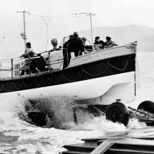 Oakley twin motor lifeboat Lilly Wainwright ON 976, Llandudno. Lifeboat being launched from trailer on slipway. Scanned from negative 193