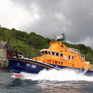 Penlee Severn Class Lifeboat 17-36 Ivan Ellen sailing past the old Penlee boathouse at Mousehole