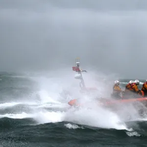 Poole Atlantic 85 class inshore lifeboat Sgt Bob Martin B-826 in rough seas heading from left to right