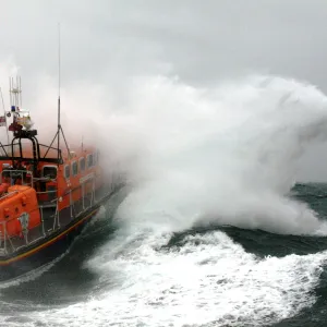 Poole Tyne class lifeboat City of Sheffield 47-023 in rough seas Lifeboat heading through a breaking wave, lots of white spray. Used in Daily Telegraph 18 / 06 / 11