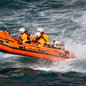 Port Isaac D-class inshore lifeboat Copeland Bell D-707. Silver gallantry medal awardee Damien Bolton on board with Bronze medal awardees Nicola-Jane Bradbury and Matthew Main crewing