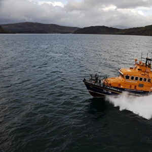 Portree trent class lifeboat Stanley Watson Barker 14-16 moving from right to left, crew on the stern and upper steering position