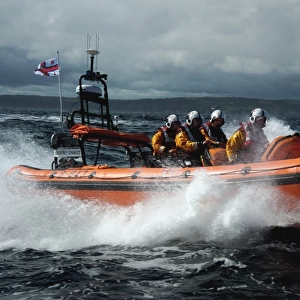 Red Bay Altantic 85 inshore lifeboat Geoffrey Charles B-843. Lifeboat moving from left to right at speed, four crew on board