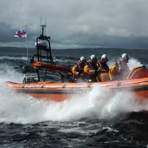 Red Bay Altantic 85 inshore lifeboat Geoffrey Charles B-843. Lifeboat moving from left to right at speed, four crew on board