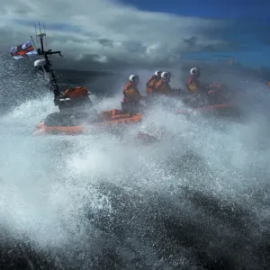 Red Bay Altantic 85 inshore lifeboat Geoffrey Charles B-843. Lifeboat moving from left to right at speed, four crew on board, lots of white spray Red Bay Altantic 85 inshore lifeboat Geoffrey Charles B-843. Lifeboat moving from left to right at speed, four crew on board, lots of white spray