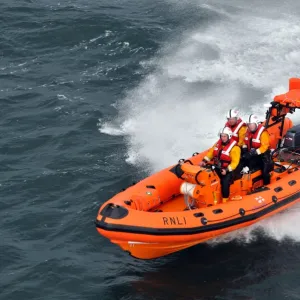 Red bay Atlantic 75 Dorothy May B-728. Aerial shot, lifeboat moving away towards the camera at speed, three crew on board