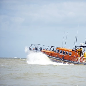 Relief Mersey class lifeboat Mary Margaret 12-28 at Eastbourne. Lifeboat moving from right to left, crew at the stern