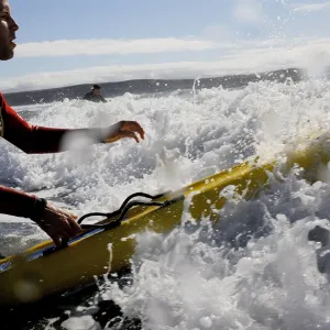 An RNLI lifeguard on a paddleboard at Woolacombe