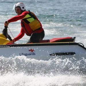 An RNLI lifeguard on a rescue water craft