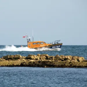 The Shannon class lifeboat RNLB Jock and Annie Slater 13-01 at Swanage to launch the stations fundraising appeal. Lifeboat moving from left to right at speed