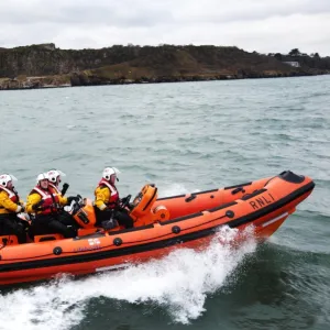 Teignmouth Atlantic 85 inshore lifeboat the Two Annes B-809 moving from left to right, four crew onboard