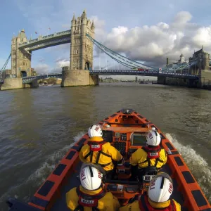 Tower E-class lifeboat Hurley Burly E-07 heading along the Thames towards Tower Bridge