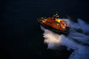 Aran Islands severn class lifeboat David Kirkaldy 17-06. Aerial shot taken from Irish Coastguard helicopter, lifeboat heading from right to left at night