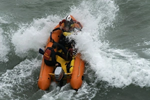 An arancia inshore rescue boat in heavy surf at Perranporth