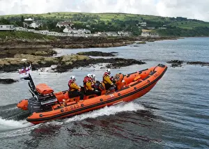 Inshore Lifeboat Prints: Atlantic 85 B-843 Geoffrey Charles moving thought the water with landsape in the background on the Red Bay Open Day